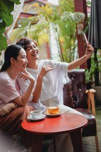 Two women at coffee take a selfie