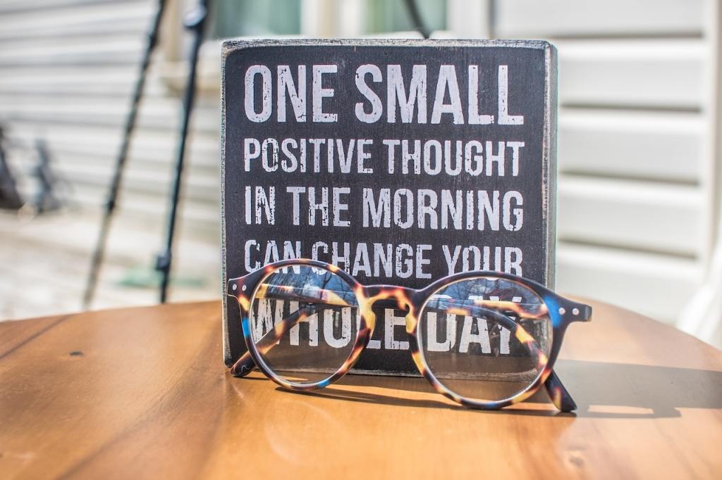 Sign reads "one small positive thought in the morning can change your whole day"