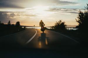 Motorcycle rider at sunset